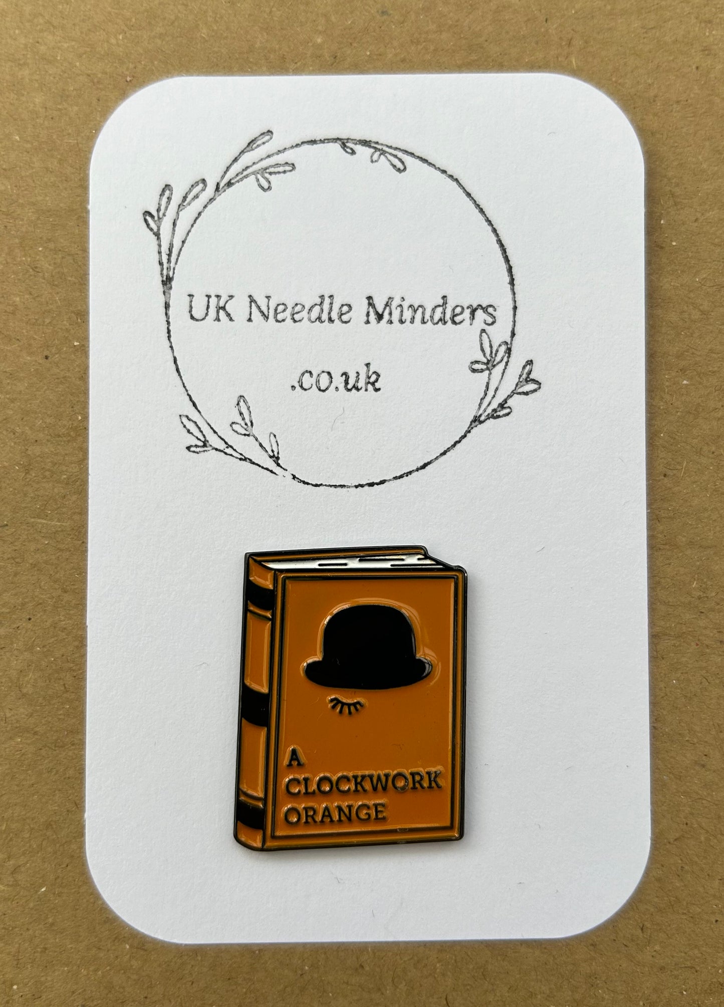 A Clockwork Orange Book enamel needle minder