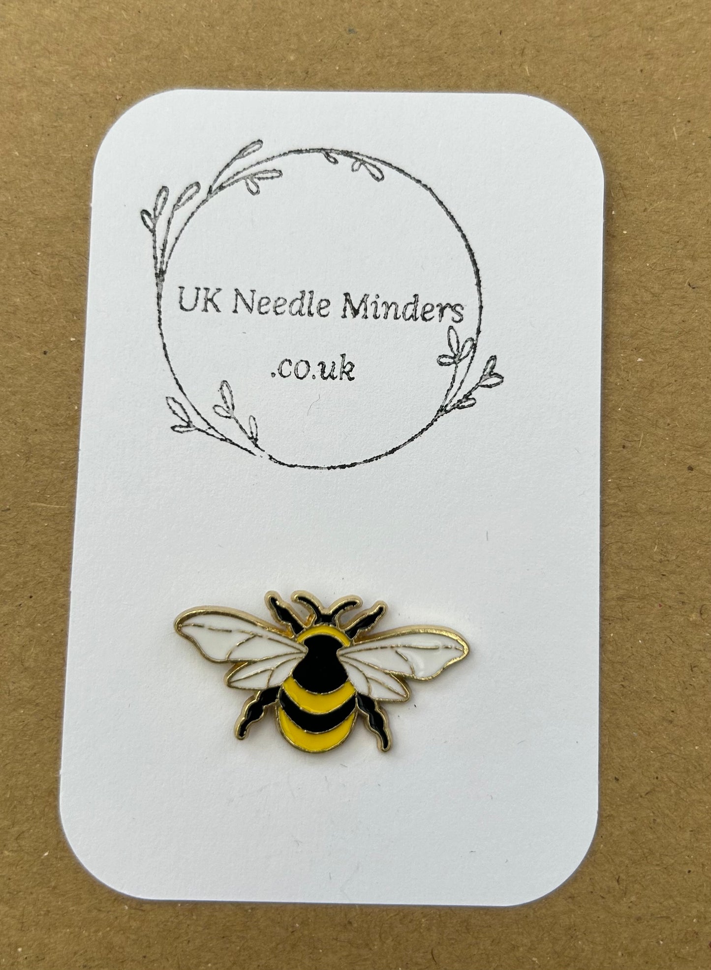 Bee enamel needle minder