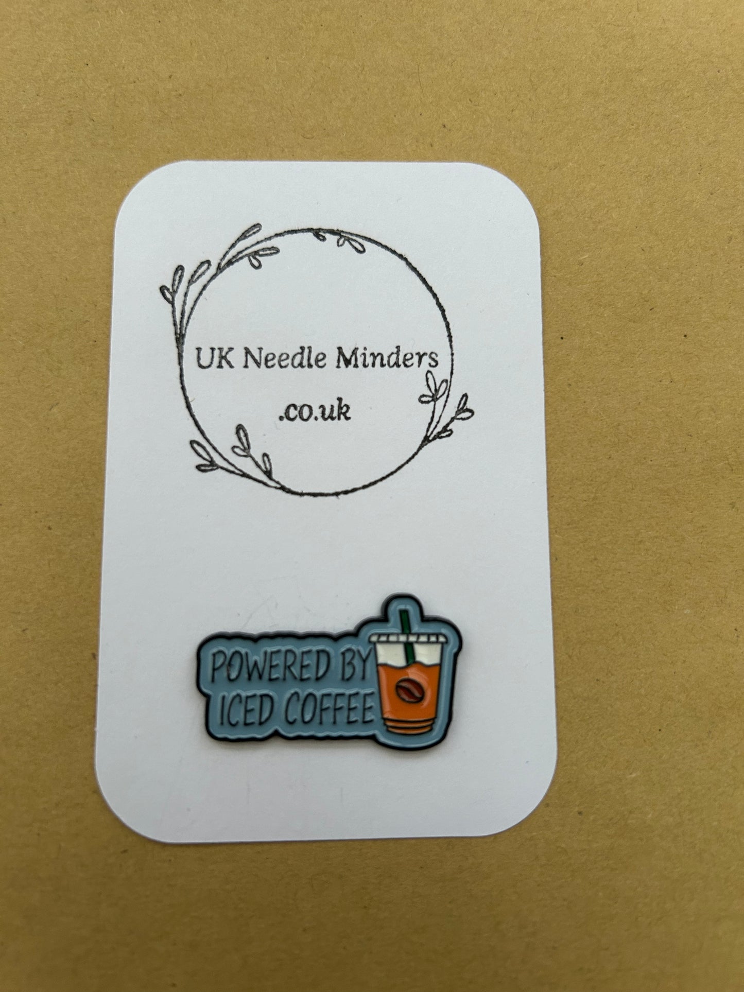Powered By Iced Coffee enamel needle minder